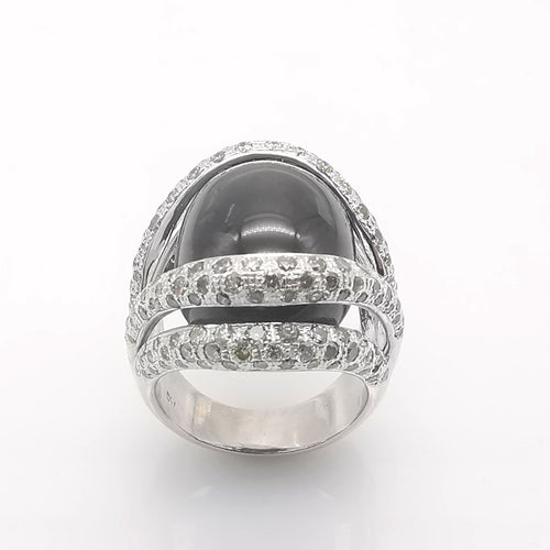 Bague 54 Bague or blanc, onyx & diamants 58 Facettes