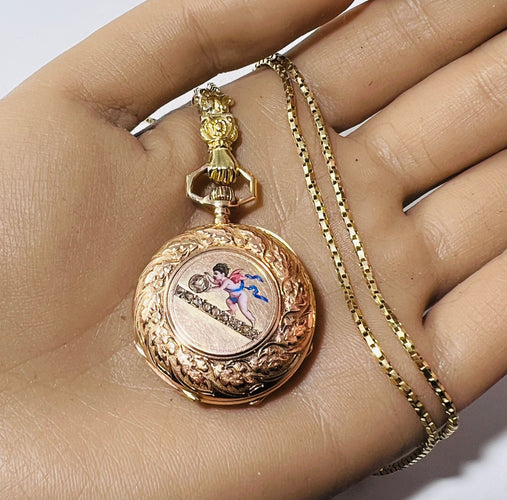 Montre Montre de col émaillé et sa chaîne en or jaune 58 Facettes 226