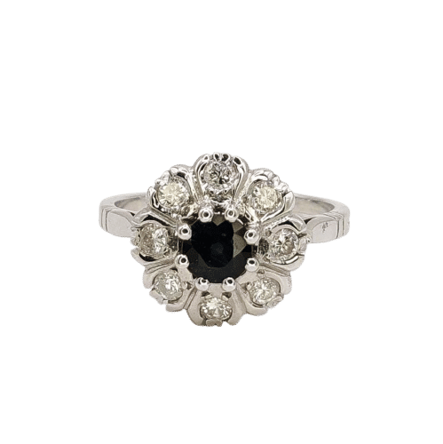 Bague 54 Bague Marguerite en or blanc ornée d'un saphir et de diamants 58 Facettes