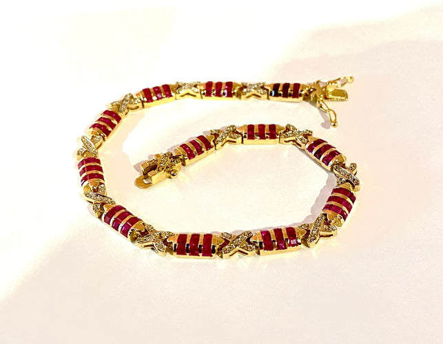 Bracelet Bracelet en or jaune, rubis calibrés et diamants 58 Facettes AB620