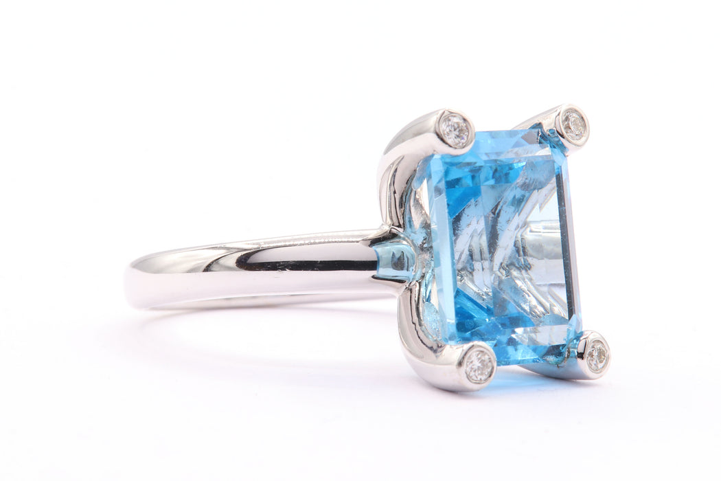 Contemporary white gold topaz diamond ring