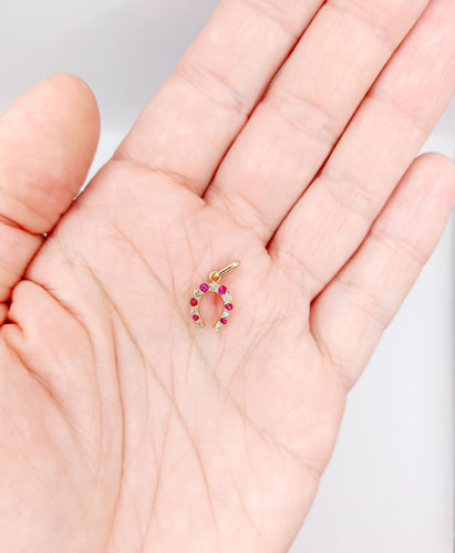 Pendentif Pendentif fer à cheval or rose, diamants et rubis (circa 1900) 58 Facettes A06034