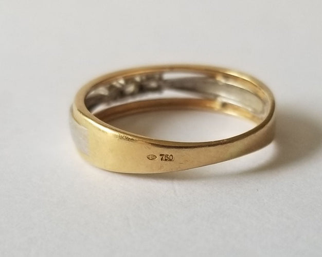 54 Bague or jaune et blanc, diamants 58 Facettes