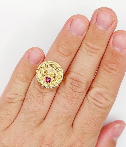 Bague 55 Bague vintage "il bat pour toi" or rose, angelots sculptant un coeur en rubis synthétique 58 Facettes A05267