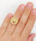 Bague 55 Bague vintage "il bat pour toi" or rose, angelots sculptant un coeur en rubis synthétique 58 Facettes A05267