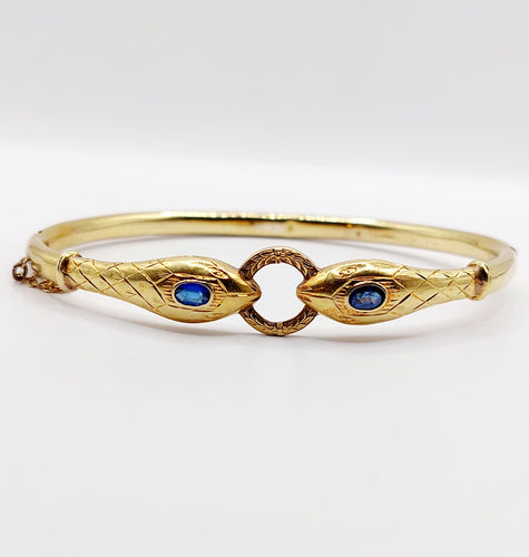Bracelet Bracelet serpent à deux têtes or jaune et pierre bleues (circa 1920) 58 Facettes A06347
