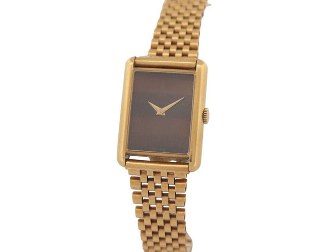 Montre vintage montre baume & mercier tank 37077 mecanique or 18k & oeil de tigre 58 Facettes 268283