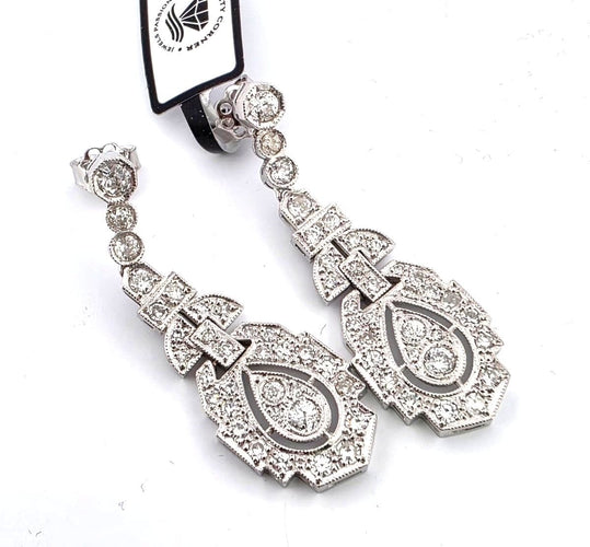 Boucles d'oreilles en platine massif serties de diamants