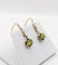 Boucles d'oreilles Dormeuses antique or jaune péridot en serti griffes 58 Facettes A05288