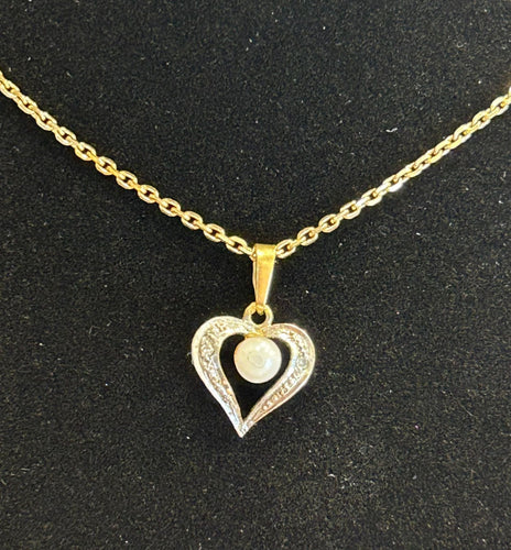 Pendentif Pendentif coeur 2 ors diamants et perle 58 Facettes LP425