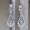 Boucles d'oreilles Boucles d'oreilles vintage ajourées en or blanc 18 carats serties de diamants 58 Facettes 135023B