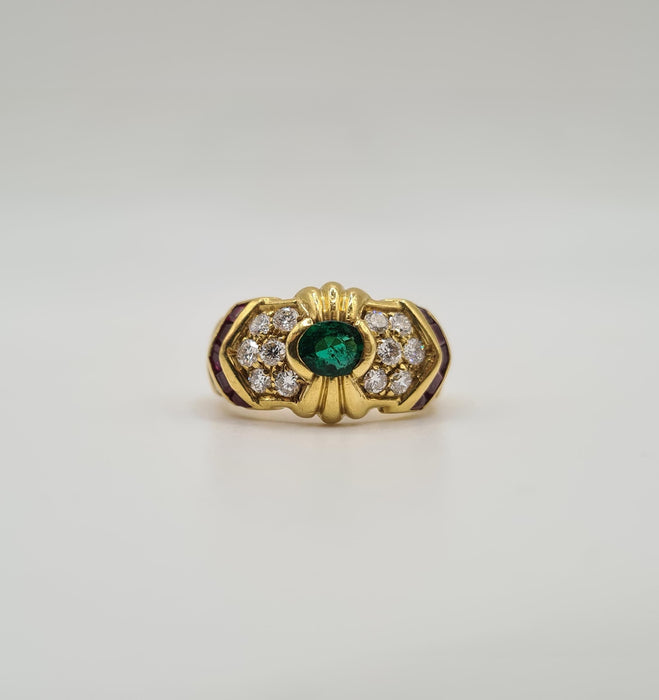 Yellow gold ring set with emerald, diamonds and rubies