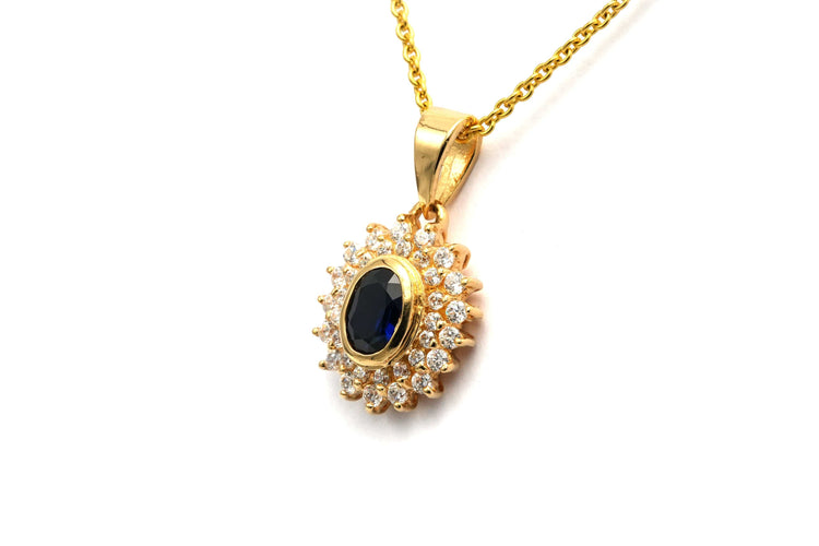 Pendentif Pendentif contemporain en or jaune serti d'un saphir et de diamants 58 Facettes B766