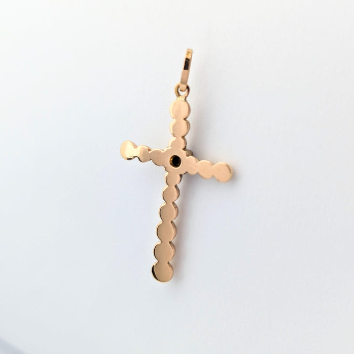 Yellow gold and ruby cross pendant