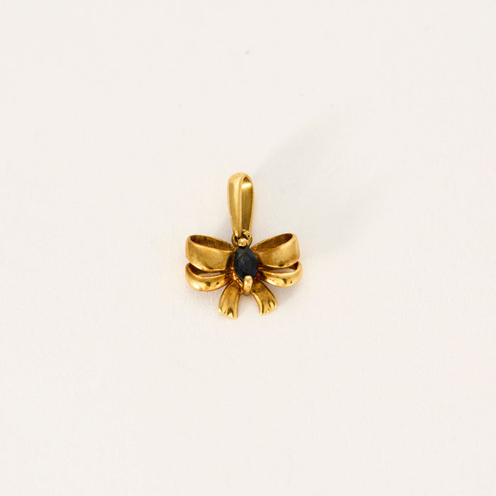 Yellow gold sapphire bow tie pendant