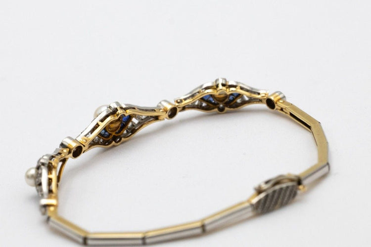 Bracelet Bracelet Art Déco avec diamants, perles et saphirs synthétiques en or jaune et platine 58 Facettes 9530