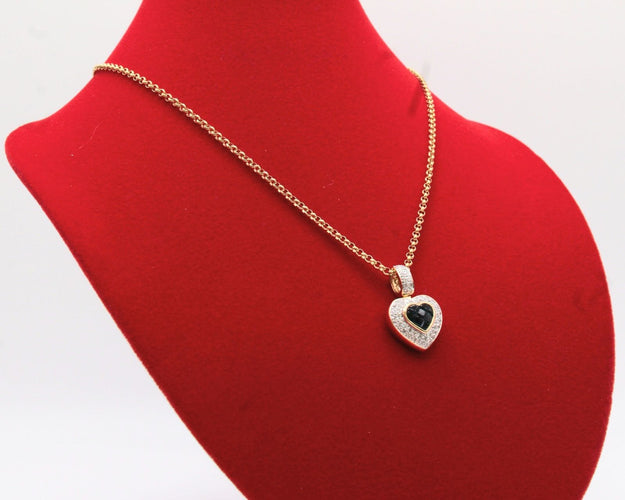 Pendentif Pendentif coeur or bicolore, saphirs, diamants 58 Facettes 250253
