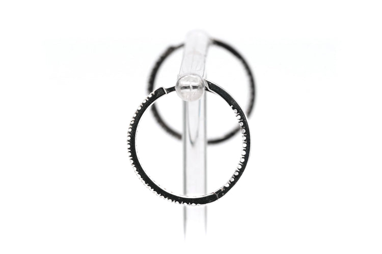 Boucles d'oreilles Créoles contemporaines en or blanc 18 carats serties de diamants taille brillant 0,64 ct 58 Facettes 23087