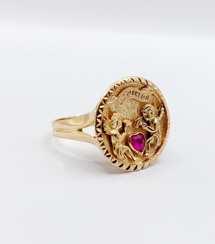 Bague 55 Bague vintage "il bat pour toi" or rose, angelots sculptant un coeur en rubis synthétique 58 Facettes A05267