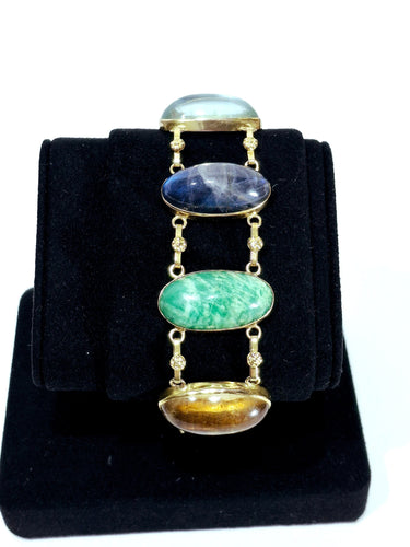 Bracelet Bracelet en or champagne 18 carats et pierres fines cabochon 58 Facettes