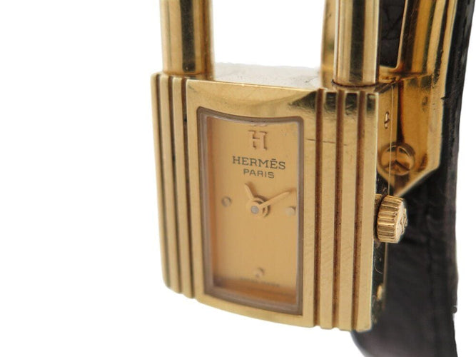 Montre montre vintage HERMES Kelly Mini Cadenas 20 mm plaque or quartz dame 58 Facettes 268902