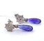 Boucles d'oreilles Boucles d'oreilles en or blanc serties de diamants et de tanzanite 58 Facettes
