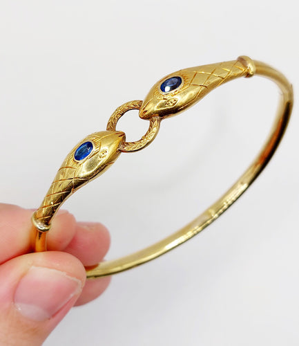 Bracelet Bracelet serpent à deux têtes or jaune et pierre bleues (circa 1920) 58 Facettes A06347