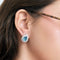 Boucles d'oreilles Boucles d'oreilles en or blanc, diamants et topaze bleue 58 Facettes LJ27