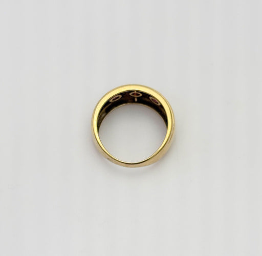 Bague 55 Bague style jarretière en or jaune sertie de rubis et diamant 58 Facettes