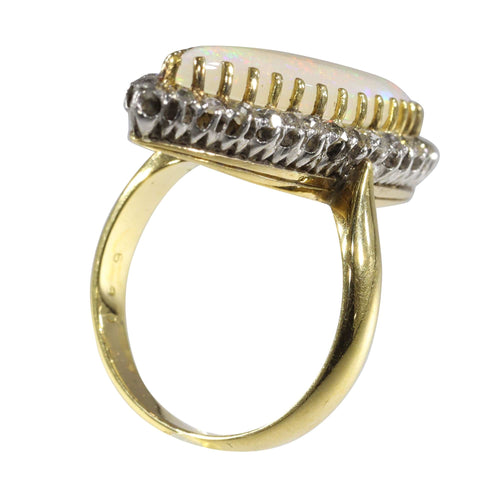 Bague 55 L'élégance victorienne : le chef-d'œuvre de la bague en opale et diamant de 1880 58 Facettes 16054-0031