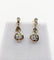 Boucles d'oreilles Dormeuses antique or jaune 18k fleur et spinelles blancs (circa 1920) 58 Facettes A06159