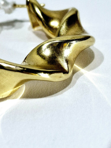 Boucles d'oreilles Paire de créole torsadées en or 58 Facettes