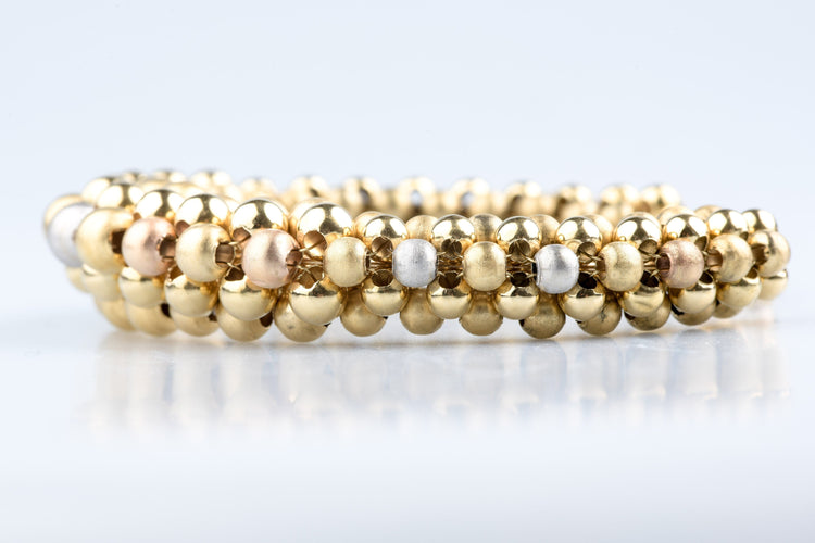 Bracelet Bracelet boules en trois ors 18k or jaune, blanc et rose 58 Facettes BRBLECC1325-107