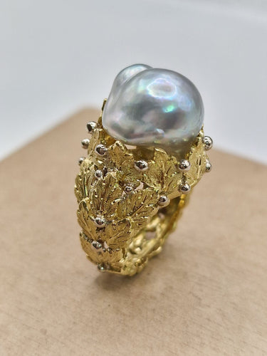 Bague 46 Bague vintage en or jaune des années 1960, ornée d'une fleur et d'une perle 58 Facettes