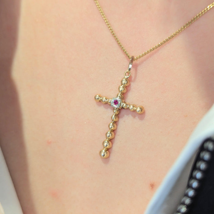 Yellow gold and ruby cross pendant