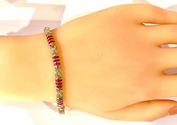Bracelet Bracelet en or jaune, rubis calibrés et diamants 58 Facettes AB620