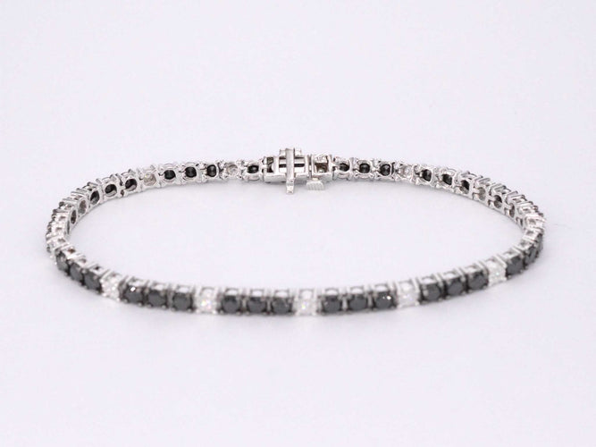 Bracelet Bracelet de tennis en or blanc serti de diamants noirs et blancs 58 Facettes 2119