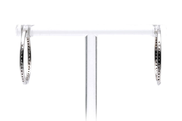 Boucles d'oreilles Créoles contemporaines en or blanc 18 carats serties de diamants taille brillant 0,64 ct 58 Facettes 23087