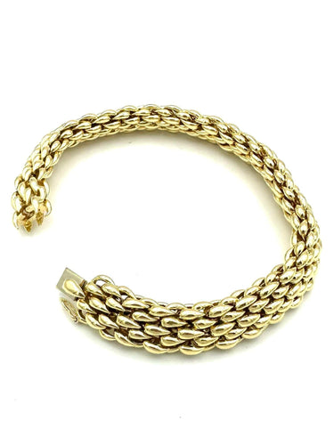 Bracelet CHAUMET. Bracelet vintage or jaune 18K 58 Facettes