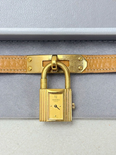 Montre Hermès - Montre Kelly en plaqué or, bracelet cuir camel 58 Facettes WC-2025-2302