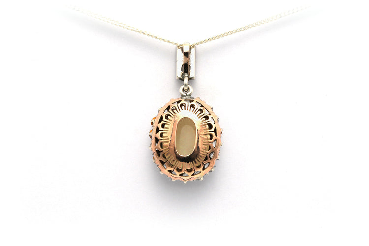 Pendentif Pendentif art déco en or jaune et argent serti d'une opale 58 Facettes B528