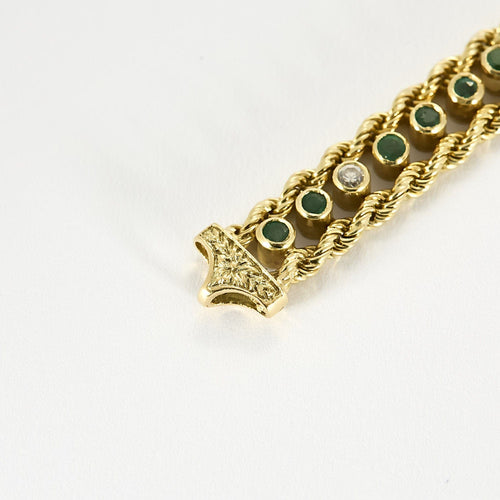 Elegant armbånd i gult gull, diamanter og smaragder 