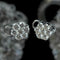 White gold and diamond daisy ear clips