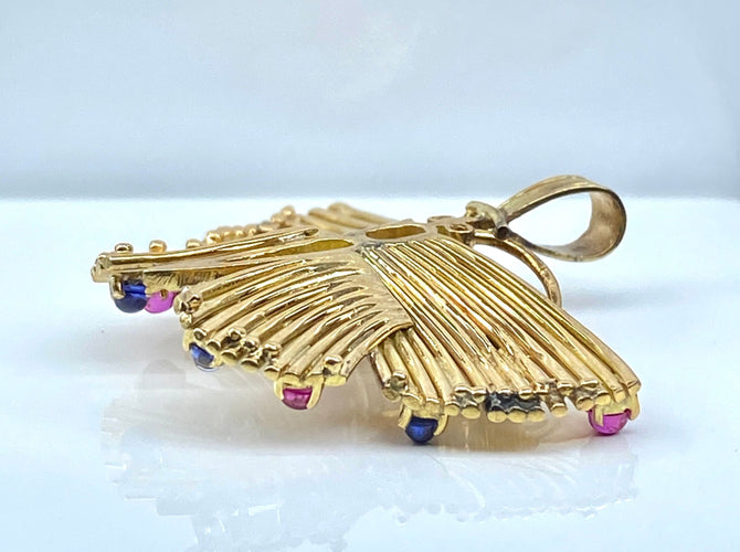 Pendente a farfalla in oro giallo e pietre preziose 