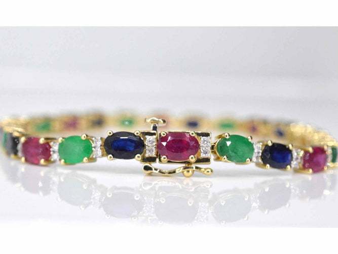 Bracelet Bracelet tennis en or avec diamants, saphir, rubis et émeraude 58 Facettes 2069