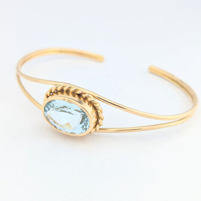 Bracciale bangle in oro giallo e acquamarina