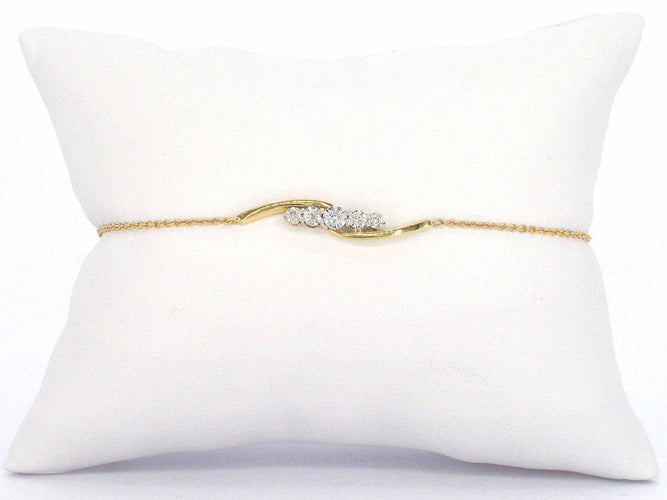 Bracelet Bracelet en or jaune avec diamants sertis en rang 58 Facettes 2361