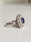 Bague 57 Bague Marguerite en or blanc, saphir et diamants 58 Facettes