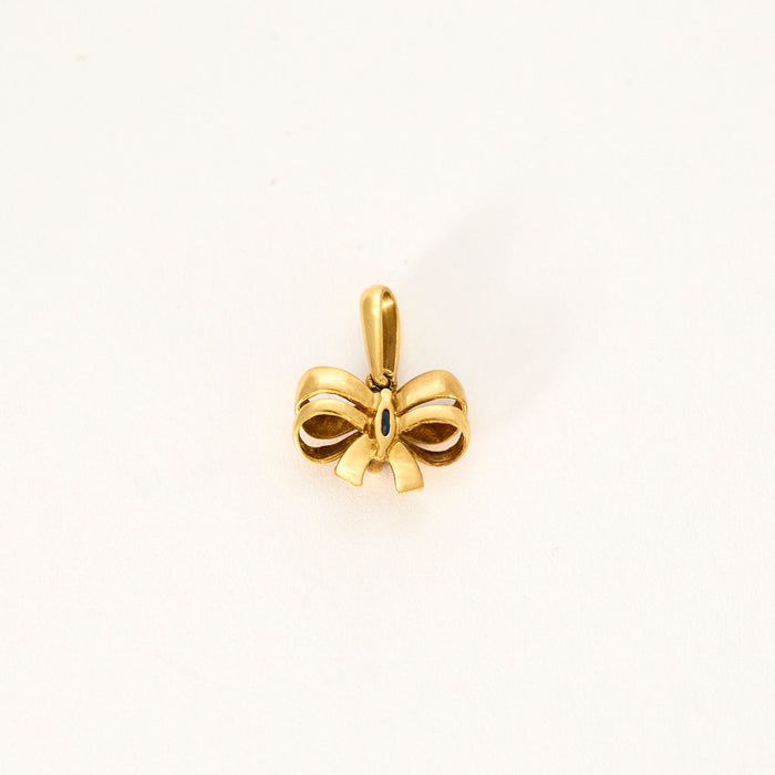 Yellow gold sapphire bow tie pendant