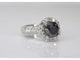 Bague 54 Bague entourage en or blanc avec gros diamants et un diamant noir 58 Facettes 2049
